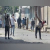 Tension prevails in Mangaluru after stone peltings on places of worship | India News Protesters throw stones on security personnel after an encounter with militants, at Batamaloo in Srinagar. Photo: PTI