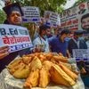 NSUI members prepare ''pakodas" during a protest to mark the 70th birthday of Prime Minister Narendra Modi as National Unemployment Day, in New Delhi