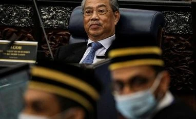 Malaysia to raise 2021 spending to counter coronavirus impact on economy Malaysia's Prime Minister Muhyiddin Yassin