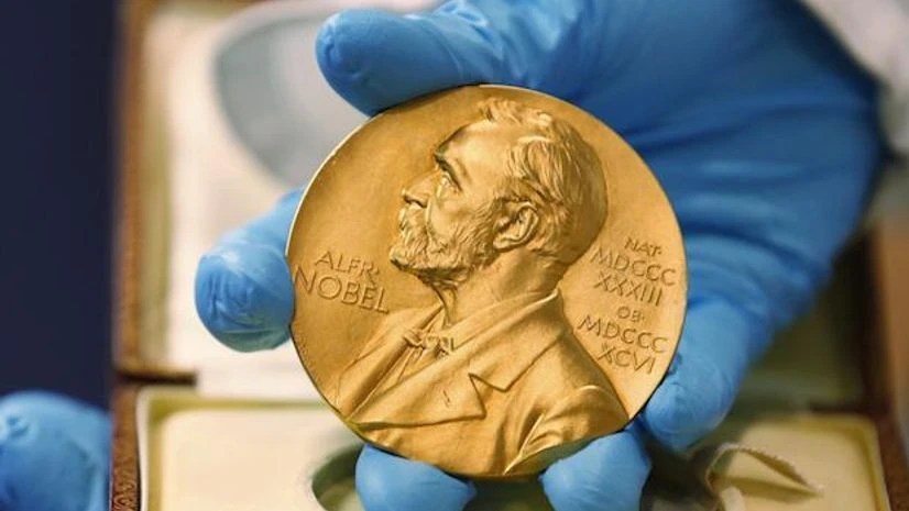 Nobel, Nobel Prize A national library employee shows a gold Nobel Prize medal in Bogota, Colombia | AP/PTI