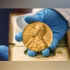 A national library employee shows a gold Nobel Prize medal in Bogota, Colombia | AP/PTI