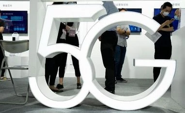 After 2 years, smartphone users still hungry for 5G, faster speed Visitors wearing mask to protect from the coronavirus walk past a 5G sign at the China Beijing International High Tech Expo in Beijing, China