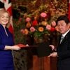 Britain's International Trade Secretary Elizabeth Truss and Japanese Foreign Minister Toshimitsu Motegi pose with documents at a signing ceremony of the UK-Japan Comprehensive Economic Partnership Agreement in Tokyo. Photo: Reuters