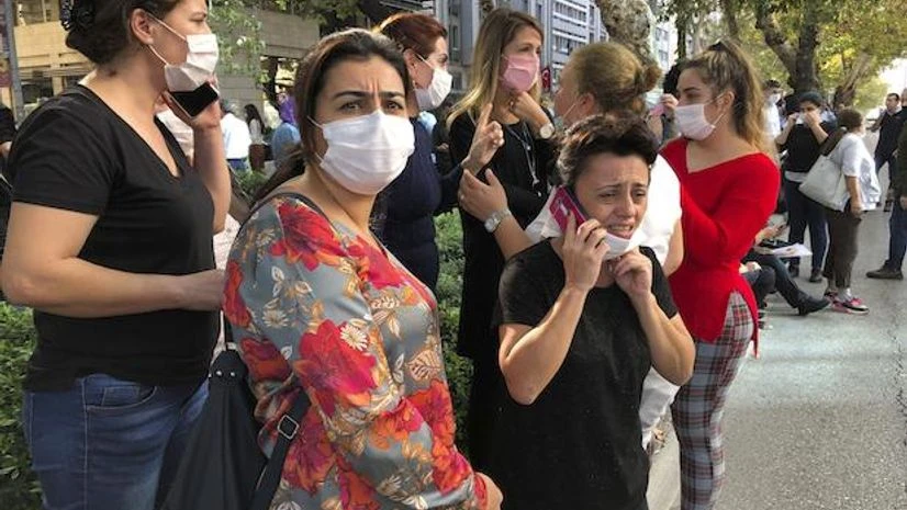 Turkey, Earthquake People stand outside their homes in Izmir, Turkey, Friday, Oct. 30, 2020, after a strong earthquake in the Aegean Sea has shaken Turkey and Greece