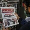 A man wearing a face mask as a precaution against the coronavirus reads the headlines about the U.S. presidential elections at a newspapers stand in Paris, Wednesday, Nov. 4, 2020 | (AP Photo/Michel Euler)