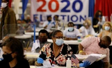 In pictures: Joe Biden inches towards victory as protests erupt across US US election