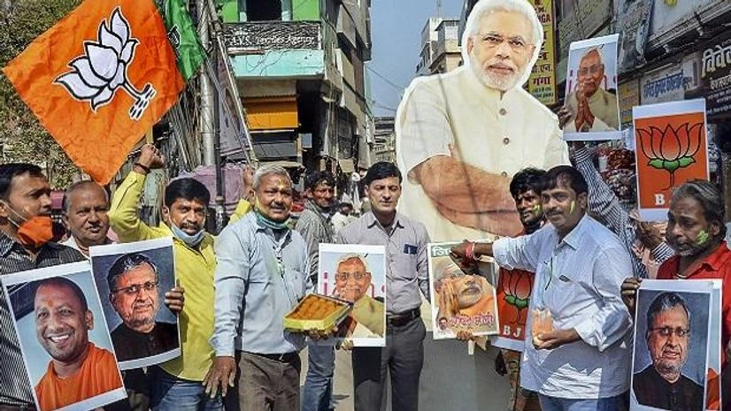 Bihar elections 2020, BJP, BJP supporters BJP supporters react during counting day of Bihar Assembly polls, in Patna, Tuesday, Nov. 10, 2020. (PTI Photo)