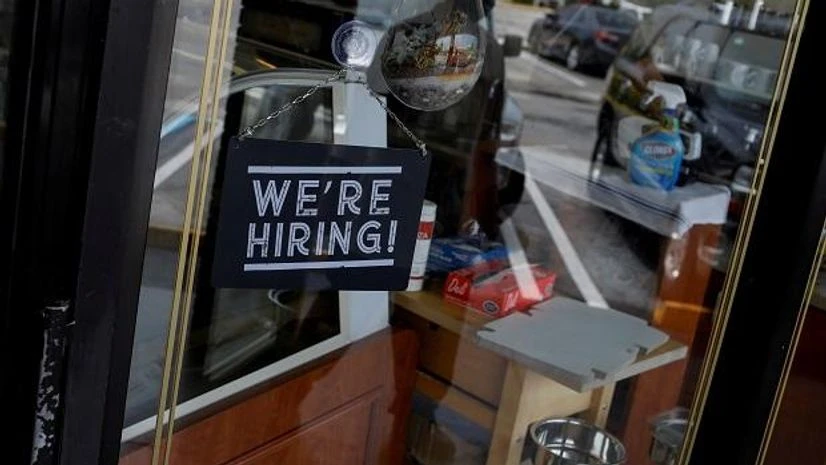 Jobs, employment, hiring A "We're Hiring" sign advertising jobs is seen at the entrance of a restaurant in Miami, Florida. Photo: Reuters