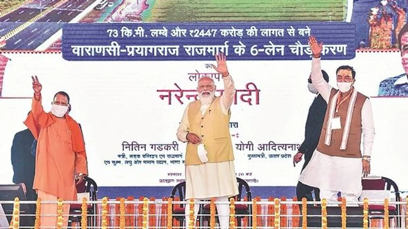 Narendra Modi, Yogi Adityanath, Keshav Prasad Maurya Prime Minister Narendra Modi (centre) before addressing a public meeting in Varanasi on Monday
