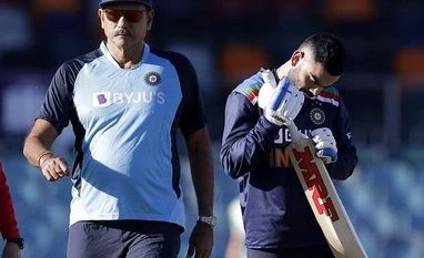 IND vs ENG: Kohli sweats it out inside hotel room ahead of Chennai Test India's captain Virat Kohli, right, and coach Ravi Shastri before the start of play at Manuka Oval, in Canberra, Australia. File Photo: AP | PTI