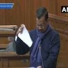 Delhi Chief Minister Arvind Kejriwal tearing up a copy of the farm laws in the Delhi assembly
