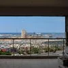 Beirut port viewed from the window of a damaged residential apartment in Beirut, Lebanon. Photo: Bloomberg