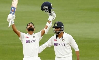 IND vs AUS 3rd Test: Jadeja has improved 'a lot' as a batsman, says Rahane Ajinkya Rahane celebrates after hitting a ton against Australia in boxing day Test. Photo: @BCCI