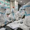 Medical staff at the Wuhan Red Cross Hospital in Wuhan on Jan. 25. Photographer: Hector Retamal/AFP/Getty Images