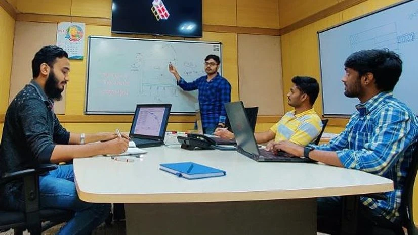 Anirudh Sharma and Tanveer Ahmed Two of the co-founders of Digantara, Anirudh Sharma (extreme right, on chair, in light blue check shirt) and Tanveer Ahmed (extreme left, on chair) at the startup's office