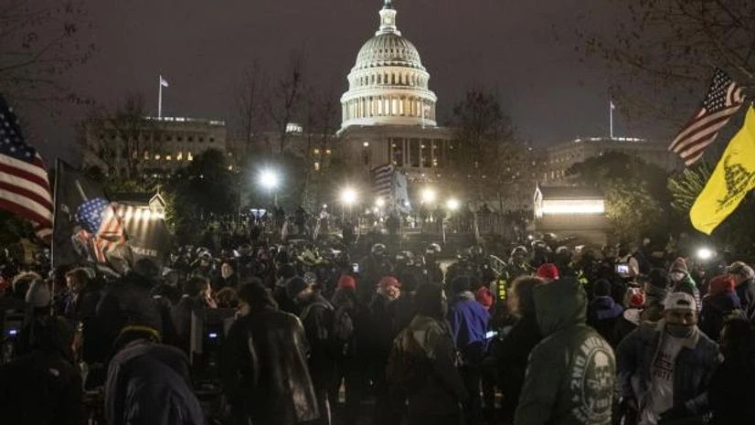 US Capitol Hill Law enforcement officers guard the U.S. Capitol building after demonstrators earlier stormed the building on Jan. 6. Photographer: Victor J. Blue/Bloomberg