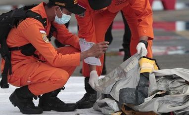 Rescuers inspect debris found in the waters around the location where a Sriwijaya Air passenger jet has lost contact with air traffic controllers shortly after the takeoff Rescuers inspect debris found in the waters around the location where a Sriwijaya Air passenger jet has lost contact with air traffic controllers shortly after the takeoff