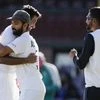 R Ashwin is embraced by Ajinkya Rahane, as teammate Mohammed Siraj, right, watches following play on the final day of the third cricket test between India and Australia at the Sydney Cricket Ground