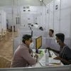 A volunteer registers for a coronavirus vaccine at a hospital in Mumbai