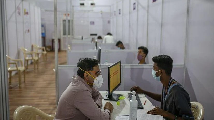 A volunteer registers for a coronavirus vaccine at a hospital in Mumbai A volunteer registers for a coronavirus vaccine at a hospital in Mumbai