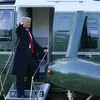 President Donald Trump gestures as he boards Marine One on the South Lawn of the White House, Wednesday, Jan. 20, 2021, in Washington. Trump is en route to his Mar-a-Lago Florida Resort. (AP Photo/Alex Brandon)
