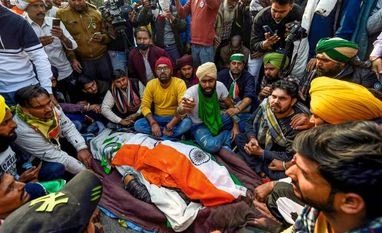 Protesting farmer dies as tractor overturns at Delhi's ITO: Police New Delhi: Farmers near the mortal remains of a protestor, who died after his tractor overturned during their tractor march at ITO on Republic Day, in New Delhi, Tuesday, Jan. 26, 2021. (PTI Photo/Kamal Singh)