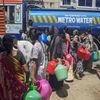 Residents fill pots from a water truck on July 4, 2019, when Chennai became one of the first major cities in the world to run dry