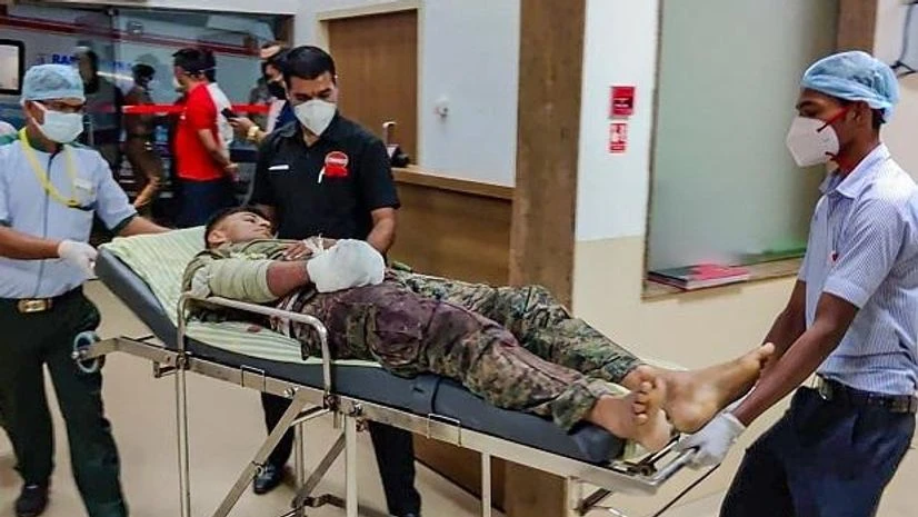 naxal attack, chhattisgarh Bijapur: A security personnel is shifted for treatment after he was injured in an encounter with Naxals in Bijapur district of Chhattisgarh. (Photo: PTI)