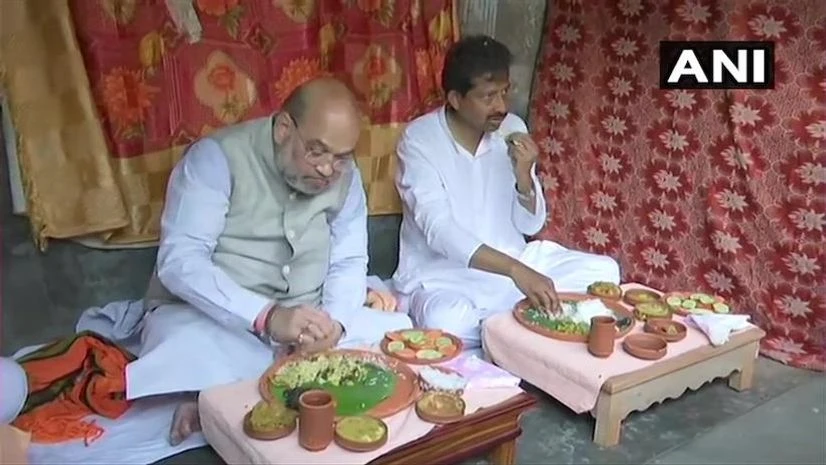 Amit Shah, West Bengal Union Home Minister and BJP leader Amit Shah lunches at the residence of a rickshaw puller who is also a BJP supporter | Photo: ANI