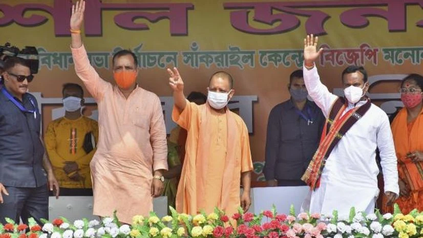 Yogi Adityanath Uttar Pradesh Chief Minister Yogi Adityanath waves at the crowd during an election campaign rally for West Bengal Asssembly polls, at Sankrail in Howrah (Photo: PTI)