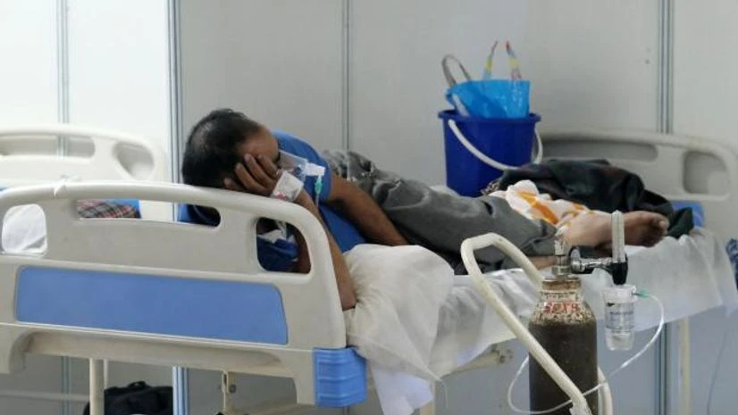 covid oxygen A patient receives medical oxygen in a ward at the Covid-19 Care Center set up at the Commonwealth Games Village Sports Complex in New Delhi.