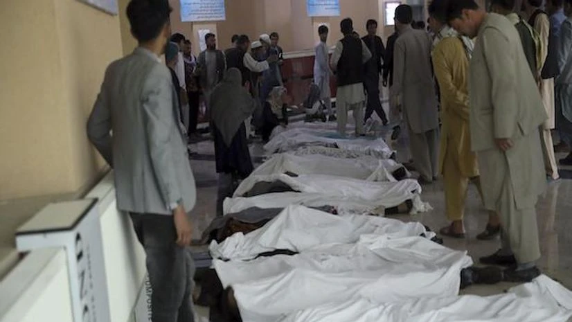 kabul blast Kabul : Afghan men try to identify the dead bodies at a hospital after a bomb explosion near a school west of Kabul, Afghanistan, Saturday, May 8, 2021. AP/PTI