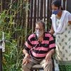 A woman assists a Covid-19 patient who is using an oxygen cylinder at a help centre in Bengaluru on Saturday, May 8, 2021. (PTI Photo)