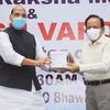 Union Defence Minister Rajnath Singh hands over to Health Minister Harsh Vardhan the newly launched anti-Covid drug 2DG, developed by DRDO, on Monday. Photo: PTI