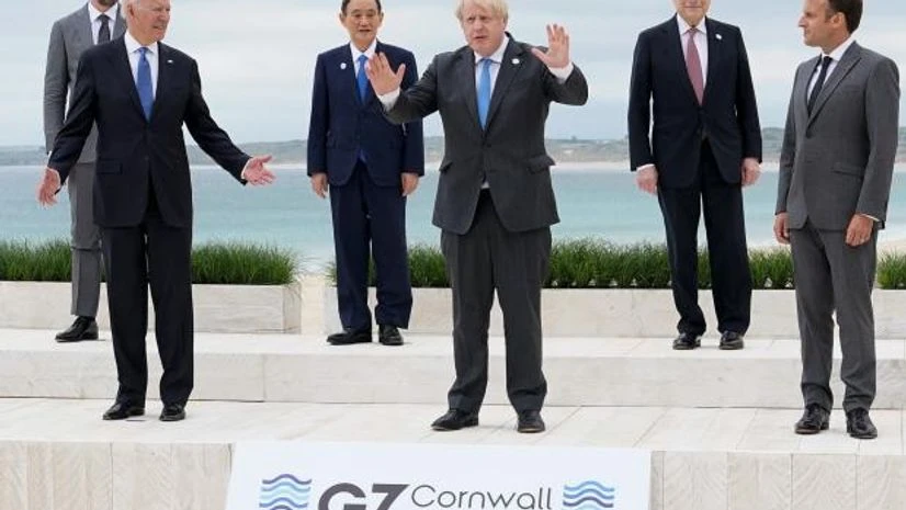 g7 imf US President Joe Biden and British Prime Minister Boris Johnson gesture as they pose for a photo with other leaders at the G7 summit, in Carbis Bay, Cornwall (Photo: Reuters)