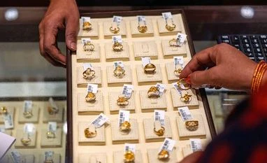 Gold tip-toes up on inflation risks despite strength in yields gold