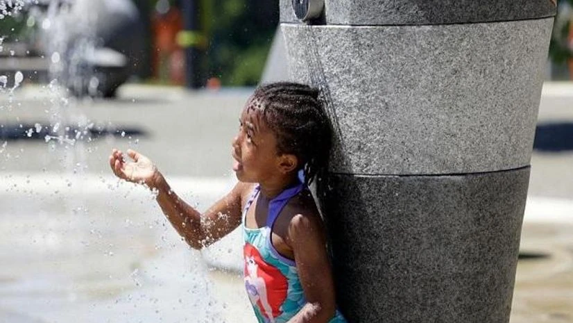 Heat Wave, Seattle Mellena O'Brien, 4, plays in the Yesler TerraceSpray Park during a heat wave hitting the Pacific Northwest, Sunday, June 27, 2021, in Seattle. (AP Photo/John Froschauer)