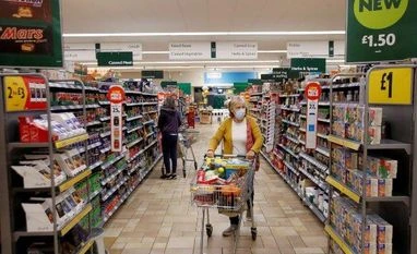 Denmark govt seeks support to reintroduce face mask use in public places A customer wearing a protective face mask shops at a grocery store (Photo: Reuters)