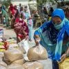 People pick up food from a collection point of non governmental organization (NGO) Vidya Dham Samiti in Banda District, Uttar Pradesh. Photo: Bloomberg