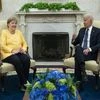 President Joe Biden meets with German Chancellor Angela Merkel in the Oval Office of the White House, Thursday, July 15, 2021, in Washington. (AP Photo/Evan Vucci)
