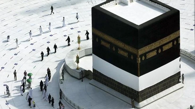 Hajj Pilgrimage Muslim pilgrims circumambulate the Kaaba, the cubic building at the Grand Mosque, as they wear masks and keep social distancing, a day before the annual hajj pilgrimage (Photo: AP/PTI)