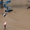 Pictures published by state media showed large sections of city roads submerged, while videos posted on social media showed passengers in flooded-out subway cars. (Photo: Bloomberg)