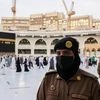 A Saudi police female officer stands guard as pilgrims perform final Tawaf during the annual Haj pilgrimage, in the holy city of Mecca, Saudi Arabia July 20, 2021. REUTERS/Ahmed Yosri/File Photo