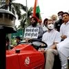 Congress leader Rahul Gandhi drives a tractor to reach Parliament in support of farmers agitation against Centres farm reform laws during Monsoon Session, in New Delhi (Photo: PTI)