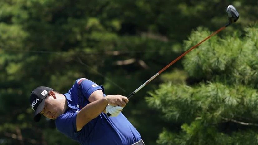 South Korea, Tokyo Olympics Korea's Si Woo Kim plays a tee shot from the 12th hole during a practice round of the men's golf event at the 2020 Summer Olympics, Tuesday, July 27, 2021, at the Kasumigaseki Country Club in Kawagoe, Japan, (AP Photo)