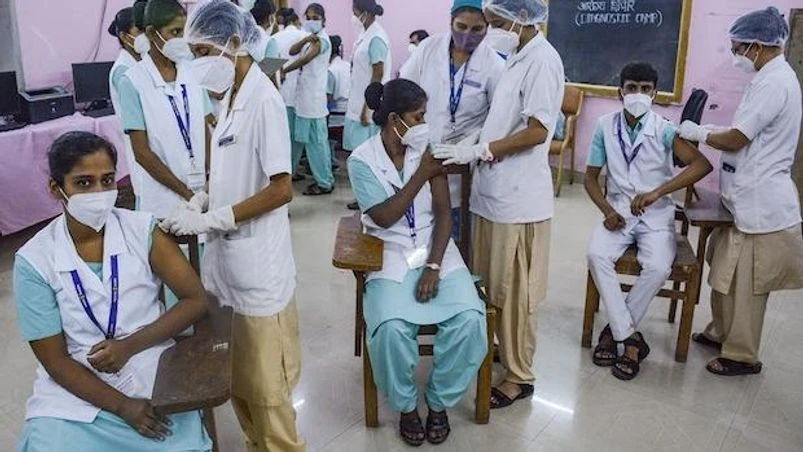 Nurses at a training college in Thane are vaccinated for Covid-19 on Friday, July 30, 2021. (PTI Photo) Nurses at a training college in Thane are vaccinated for Covid-19 on Friday, July 30, 2021. (PTI Photo)