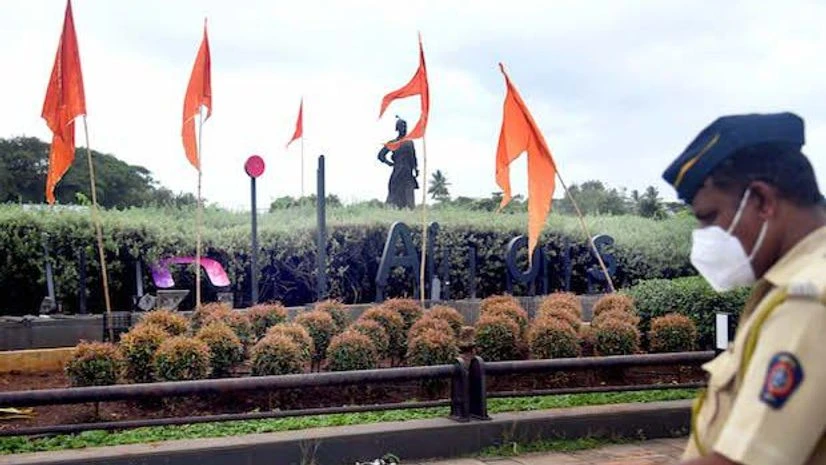 Mumbai airport Shiv Sena activists tear down Adani hoarding at Mumbai Airport