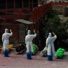 Nepalese army personnel in PPE suits salute to pay tributes to the COVID-19 victims before cremating their bodies near Pashupatinath temple in Kathmandu, Nepal. (Photo: AP/PTI)
