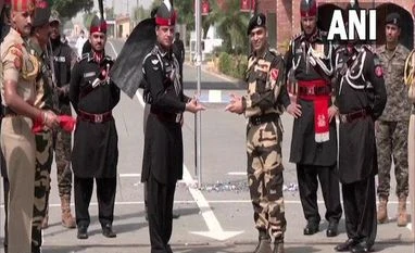 Indian,Pakistani troops exchange sweets along LoC in Kashmir on Pak's I-Day India, Pak troops exchange sweets