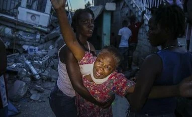 Tropical storm heads to Haiti as death toll of earthquake soars to 1,297 Haiti, earthquake